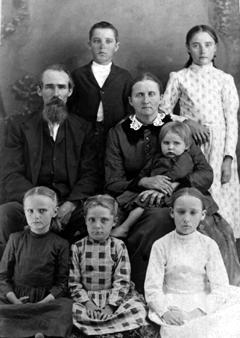 James Madison CLAYTON and Mary Elizabeth BARNES were married in October 1865 in McNairy County, Tennessee. They moved to the Plains in 1890, homesteading several sections northeast of Tulia. The twelve children born into the family were Sherman, William Bill , Matilda, Julia, Logan, Mary Frances Minnie , Amanda, Ophelia, Ida, Jim and Monte. James and Mary are buried in Rose Hill Cemetery. clayton1.jpg