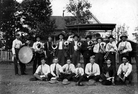 Photograph taken in front of the home of Uncle Bill Crawford about 1909. Left to right standing: Clarence Simmons, nephew of T. W. Tomlinson; Frank Scott, Sr.; Willie Hutchinson, T. W. Tomlinson, ?, Lewis Thacker, Zen Sharman, Albert Hutchinson, Mr. Jackson. Front row, sitting, left to right: Hayden Donaldson, Cleve Crawford, Jim Donaldson, Charley Barnes, Wilbur Bivins, None McCune, Horton Tracy. Driver of the wagonette belonging to his livery and stable, W. R. Foster. Uncle Bill Crawford sitting in the wagonette. tulband.jpg